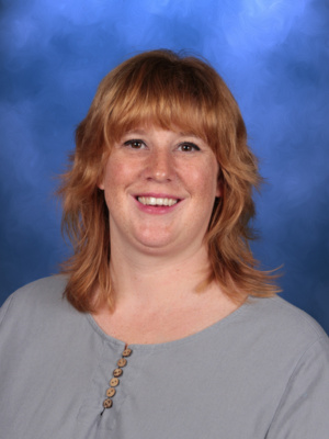 Katie Dean, Campbell Christian Schools staff member, smiling in a warm and welcoming classroom environment