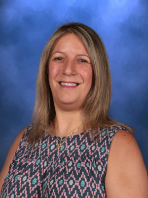 Yara Haddad, Campbell Christian Schools staff member, smiling in a classroom or school setting