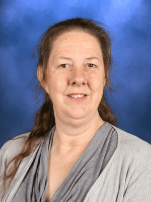 Margo Martin, Campbell Christian Schools staff member, smiling in a school environment