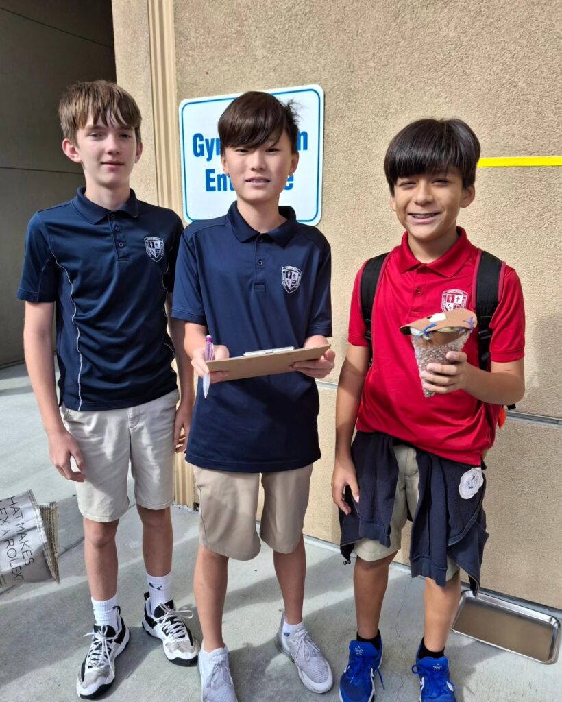 Parent with her sons smiling on the Campbell Christian Schools campus