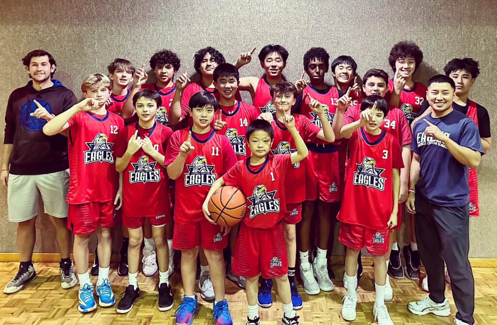 Students playing sports on the Campbell Christian Schools field during athletic practice.