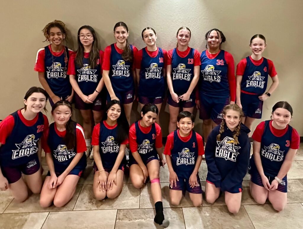 Junior high students participating in a physical education class, running and practicing teamwork activities outdoors at Campbell Christian Schools.