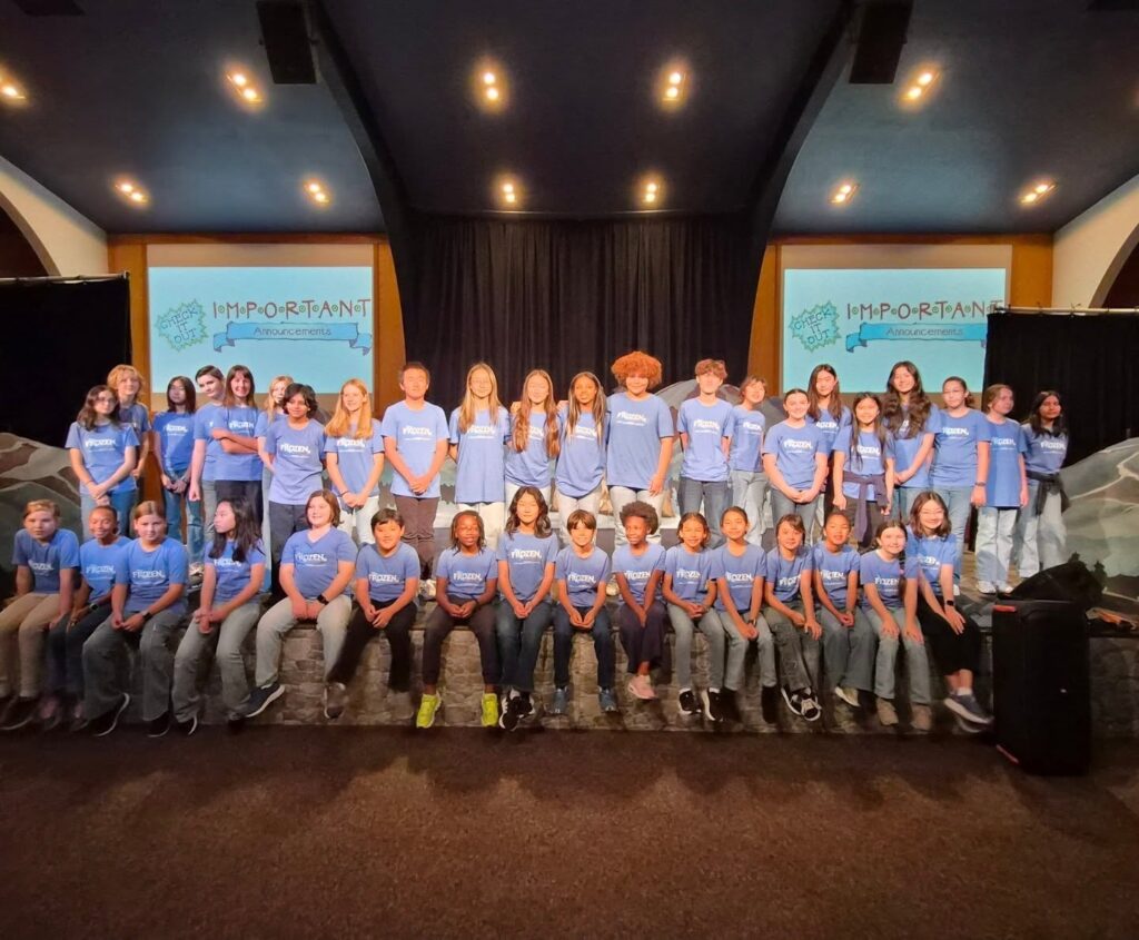 Students praying together in a classroom at Campbell Christian Schools