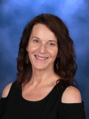 Linda Pence, Campbell Christian Schools staff member, assisting students in a learning activity