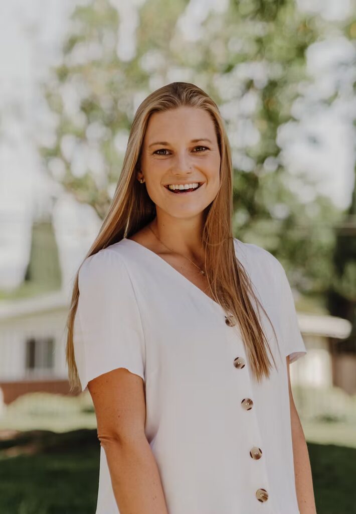 Lauren Shrader, Student Minister at Campbell Christian Schools, smiling while engaging with students.