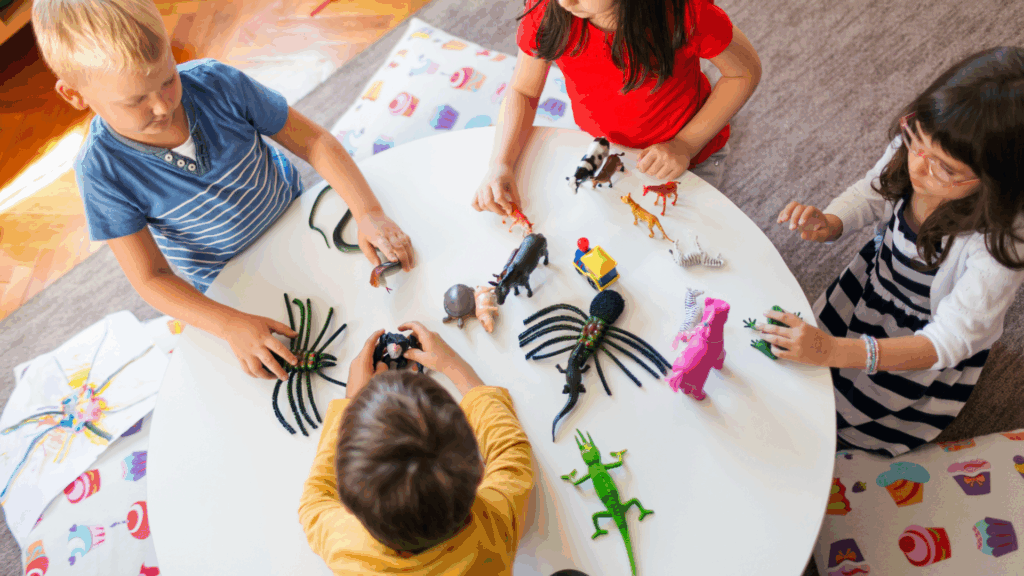 Young children engaged in learning activities in a bright and colorful classroom