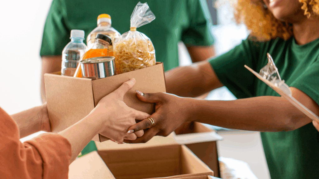 Parent speaking with a teacher about volunteering options.