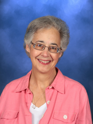 Paty Gonda-Sayre, Campbell Christian Schools staff member, smiling in a school environment