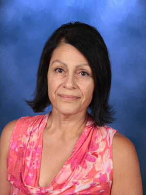 Olivia Andrews, staff member at Campbell Christian Schools, smiling in a welcoming campus setting