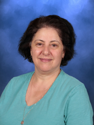 Inna Wyess, Campbell Christian Schools staff member, smiling while interacting with students in the classroom
