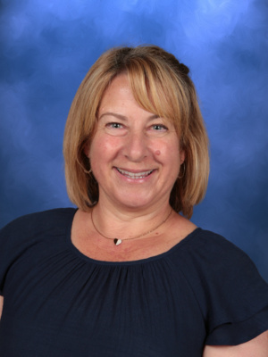 Suzy Negrette, Campbell Christian Schools staff member, smiling in a classroom setting