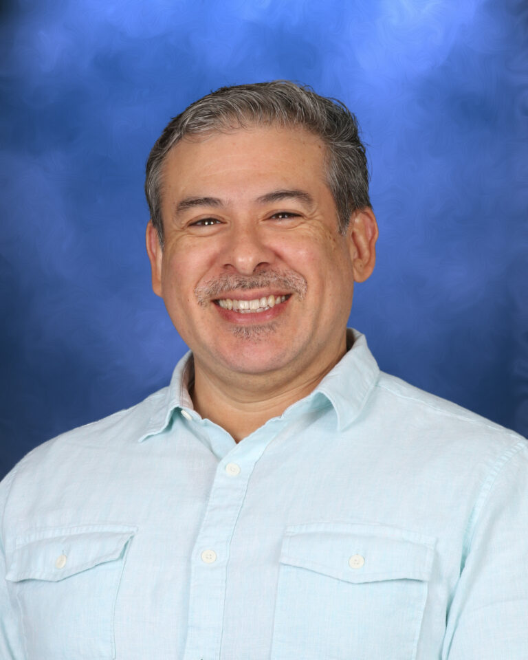 Vinnie Negrette, Campbell Christian Schools staff member, engaging with students in a classroom setting