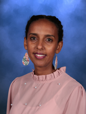 Tsega Keleta, Campbell Christian Schools staff member, smiling in a classroom setting