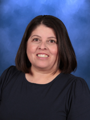 Lisa Rizo, Campbell Christian Schools staff member, assisting students in a classroom setting